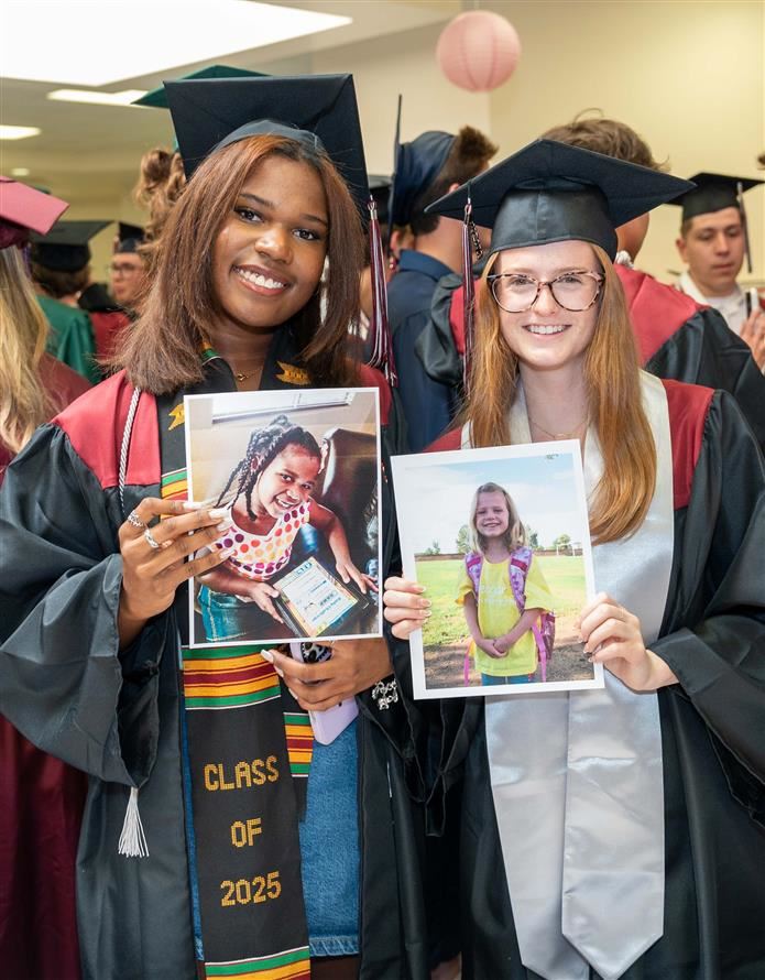 Two senior students return to elementary Fulton for grad walk